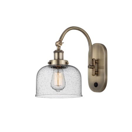 A large image of the Innovations Lighting 918-1W-13-8 Bell Sconce Antique Brass / Seedy