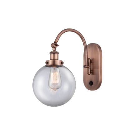 A large image of the Innovations Lighting 918-1W-15-8 Beacon Sconce Antique Copper / Clear
