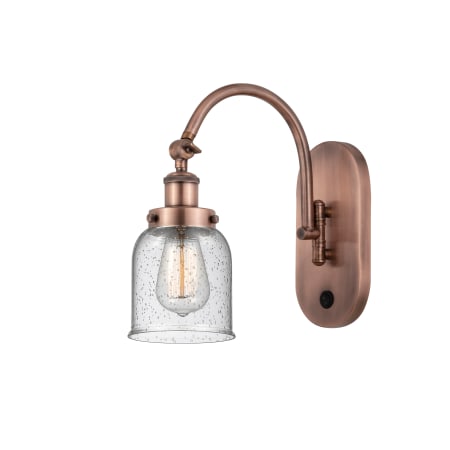 A large image of the Innovations Lighting 918-1W-13-5 Bell Sconce Antique Copper / Seedy