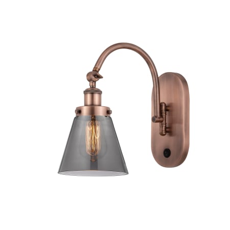 A large image of the Innovations Lighting 918-1W-13-7 Cone Sconce Antique Copper / Plated Smoke