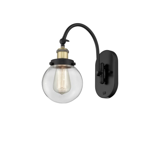 A large image of the Innovations Lighting 918-1W-13-6 Beacon Sconce Black Antique Brass / Clear