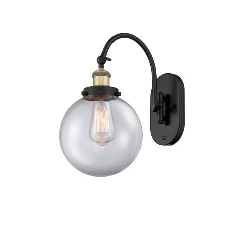 A large image of the Innovations Lighting 918-1W-15-8 Beacon Sconce Black Antique Brass / Clear