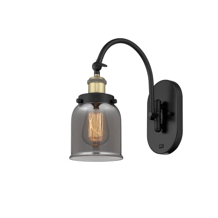 A large image of the Innovations Lighting 918-1W-13-5 Bell Sconce Black Antique Brass / Plated Smoke