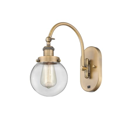 A large image of the Innovations Lighting 918-1W-13-6 Beacon Sconce Brushed Brass / Clear