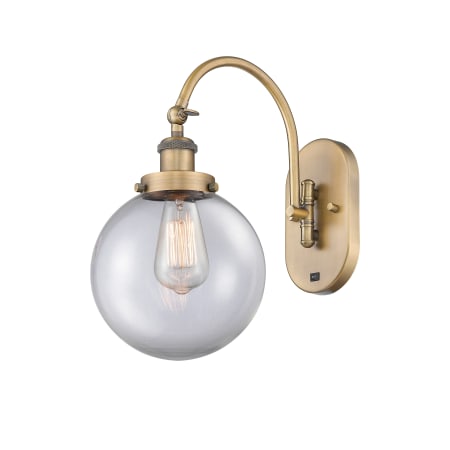 A large image of the Innovations Lighting 918-1W-15-8 Beacon Sconce Brushed Brass / Clear