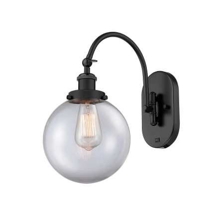 A large image of the Innovations Lighting 918-1W-15-8 Beacon Sconce Matte Black / Clear