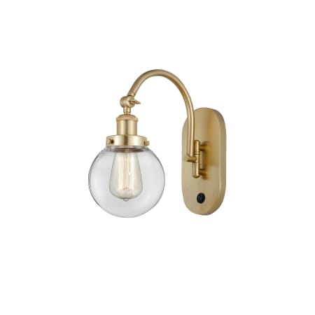 A large image of the Innovations Lighting 918-1W-13-6 Beacon Sconce Satin Gold / Clear