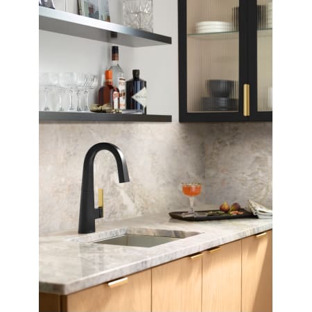 A large image of the Moen S55005 Matte Black Faucet with Brushed Gold Handle