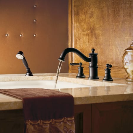 A large image of the Moen TS213 Moen-TS213-Installed Roman Tub Faucet in Wrought Iron
