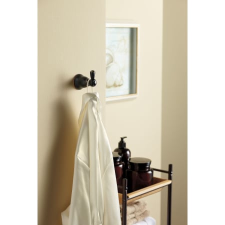 A large image of the Moen YB1003 Moen-YB1003-Bronze In Use
