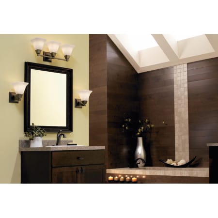 A large image of the Progress Lighting P3136 P3135 and P3137 Bathroom Lights with Delta's Dryden Faucets