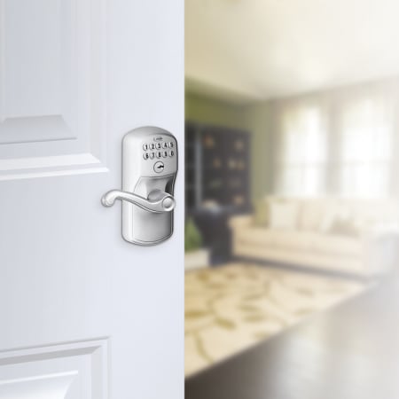 A large image of the Schlage FE595-PLY-FLA Schlage's FE595-PLY-FLA in Satin Chrome on door.