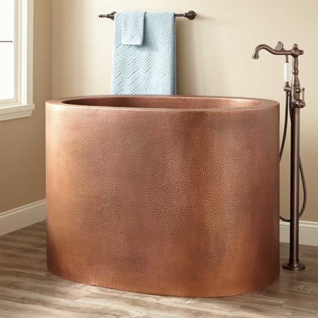 A large image of the Signature Hardware 953052 Antique Copper Patina / Black Drain