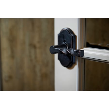 A large image of the Weslock 7110N Monoghan Lever with Premier Rosette in Oil Rubbed Bronze