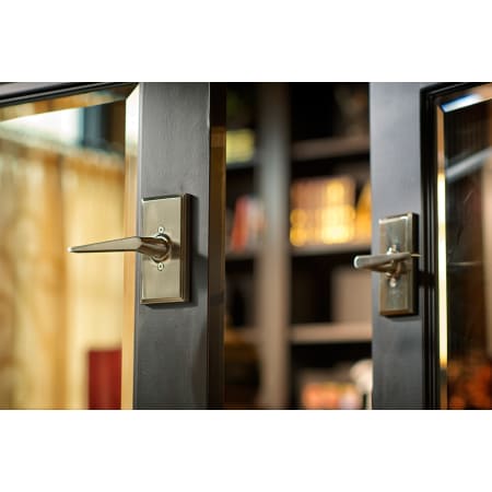 A large image of the Weslock 37052 Urbana Lever with Square Rosette in Satin Nickel