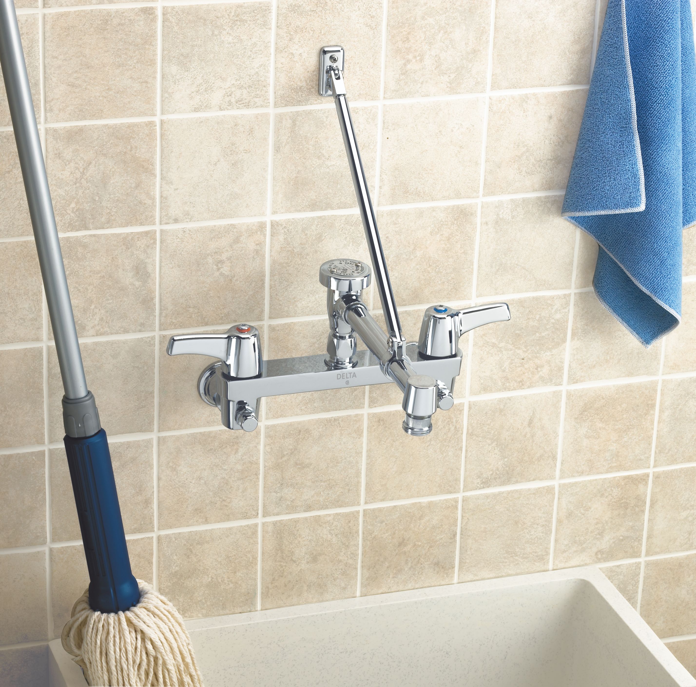 Delta 28C2383 Chrome Double Handle Ceramic Disc Wallmount Faucet with Lever  Blade Handles Long Spout with Brace and Body Mounted Angle Vacuum Breaker  from the Commercial Series