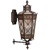 Fine Art Handcrafted Lighting Chateau Outdoor Four-Light Outdoor Wall Sconce with Gold Accents and Antiqued Glass Variegated Rich Umber Patina
