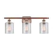 Innovations Lighting Cobbleskill 3 Light 26" Wide Bathroom Vanity Light Antique Copper / Clear