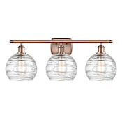 Innovations Lighting Deco Swirl 3 Light 26" Wide Bathroom Vanity Light Antique Copper / Clear