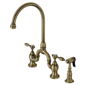 Kingston Brass Tudor 1.8 GPM Deck Mounted Bridge Double Handle Kitchen Faucet - Includes Side Spray Antique Brass