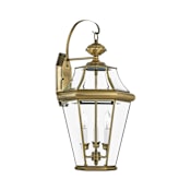 Livex Lighting Georgetown 3 Light 24" Tall Outdoor Wall Sconce with Clear Glass Shade Antique Brass