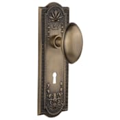 Nostalgic Warehouse Vintage Farmhouse Egg Shaped Homestead Solid Brass Passage Door Knob Set with Meadows Rose, Keyhole and 2-3/8" Backset Antique Brass