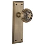 Nostalgic Warehouse Egg and Dart Solid Brass Passage Door Knob Set with New York Rose and 2-3/8" Backset Antique Brass