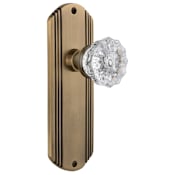 Nostalgic Warehouse Vintage Fluted Crystal Passage Door Knob Set with Art Deco Plate and 2-3/8" Backset Antique Brass