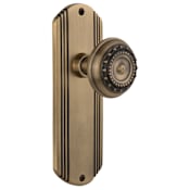 Nostalgic Warehouse Meadows Solid Brass Passage Door Knob Set with Art Deco Back Plate and 2-3/8" Backset Antique Brass