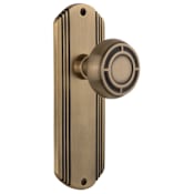 Nostalgic Warehouse Vintage Mission Solid Brass Passage Door Knob Set with Art Deco Plate and 2-3/8" Backset Antique Brass