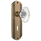 Nostalgic Warehouse Vintage Farmhouse Oval Fluted Crystal Flower Single Dummy Door Knob with Art Deco Plate and Keyhole Antique Brass