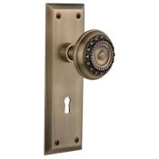 Nostalgic Warehouse Meadows Solid Brass Privacy Door Knob Set with New York Rose, Keyhole and 2-3/8" Backset Antique Brass