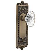 Nostalgic Warehouse Vintage Oval Fluted Crystal Flower Passage Door Knob Set with Solid Brass Victorian Egg and Dart Back Plate and 2-3/4" Backset Antique Brass