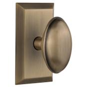 Nostalgic Warehouse Homestead Solid Brass Passage Door Knob Set with Studio Rose and 2-3/4" Backset Antique Brass