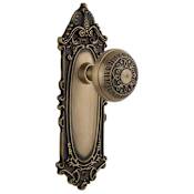 Nostalgic Warehouse Egg and Dart Solid Brass Passage Door Knob Set with Victorian Rose and 2-3/4" Backset Antique Brass