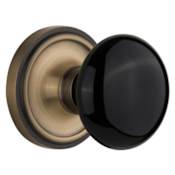 Nostalgic Warehouse Black Porcelain Passage Door Knob Set with Solid Brass Classic Rose Plate and 2-3/8" Backset Antique Brass