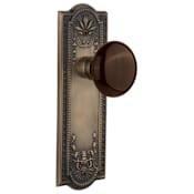 Nostalgic Warehouse Brown Porcelain Solid Brass Privacy Door Knob Set with Meadows Rose and 2-3/8" Backset Antique Brass