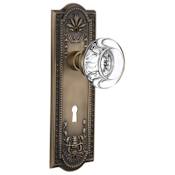 Nostalgic Warehouse Round Clear Crystal Solid Brass Passage Door Knob Set with Meadows Rose, Keyhole and 2-3/4" Backset Antique Brass