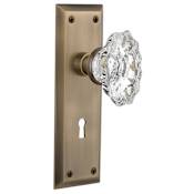 Nostalgic Warehouse Chateau Solid Brass Passage Door Knob Set with New York Rose, Keyhole and 2-3/4" Backset Antique Brass