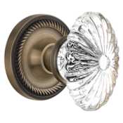 Nostalgic Warehouse Oval Fluted Crystal Solid Brass Privacy Door Knob Set with Rope Rose and 2-3/8" Backset Antique Brass