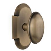 Nostalgic Warehouse Vintage Farmhouse Homestead Oval Solid Brass Passage Door Knob Set with Cottage Style Plate and 2-3/8" Backset Antique Brass