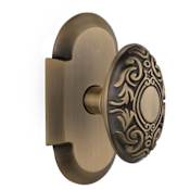 Nostalgic Warehouse Victorian Solid Brass Passage Door Knob Set with Cottage Style Plate and 2-3/8" Backset Antique Brass