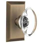 Nostalgic Warehouse Oval Clear Crystal Solid Brass Single Dummy Door Knob with Studio Rose Antique Brass