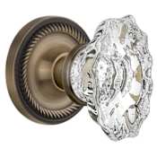 Nostalgic Warehouse Vintage Chateau Fluted Crystal Passage Door Knob Set with Solid Brass Rose with Rope Trim and 2-3/8" Backset Antique Brass