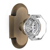 Nostalgic Warehouse Vintage Luxe Waldorf Lead Crystal Octagon Privacy Door Knob Set with Solid Brass Cottage Style Plate and 2-3/4" Backset Antique Brass