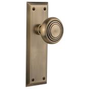 Nostalgic Warehouse Deco Solid Brass Privacy Door Knob Set with New York Rose and 2-3/4" Backset Antique Brass