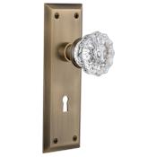 Nostalgic Warehouse Crystal Solid Brass Privacy Door Knob Set with New York Rose, Keyhole and 2-3/4" Backset Antique Brass