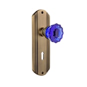 Nostalgic Warehouse Deco Solid Brass Rose Privacy Door Knob Set with Cobalt Crystal Knob and Decorative Keyhole for 2-3/8" Backset Antique Brass