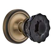 Nostalgic Warehouse Classic Solid Brass Rose Privacy Door Knob Set with Black Crystal Knob and 2-3/8" Backset Antique Brass
