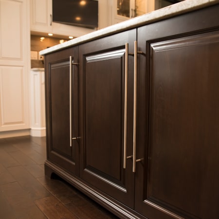 Belwith Keeler-B074879-Pull on Dark Wood Cabinet